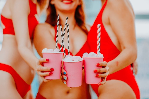 three-pretty-women-red-swim-600nw-2157257527